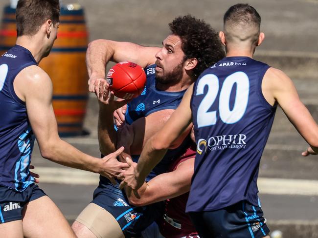 NEWS ADV Adelaide Footy League division 1 grand final. Glenunga v Prince Alfred OC at Coopers Stadium (Norwood).GlenungaÃ¢â¬â¢s  Abaina Davis handballs to team members Harry Prosser and Samuel Parsons Image/Russell Millard Photography