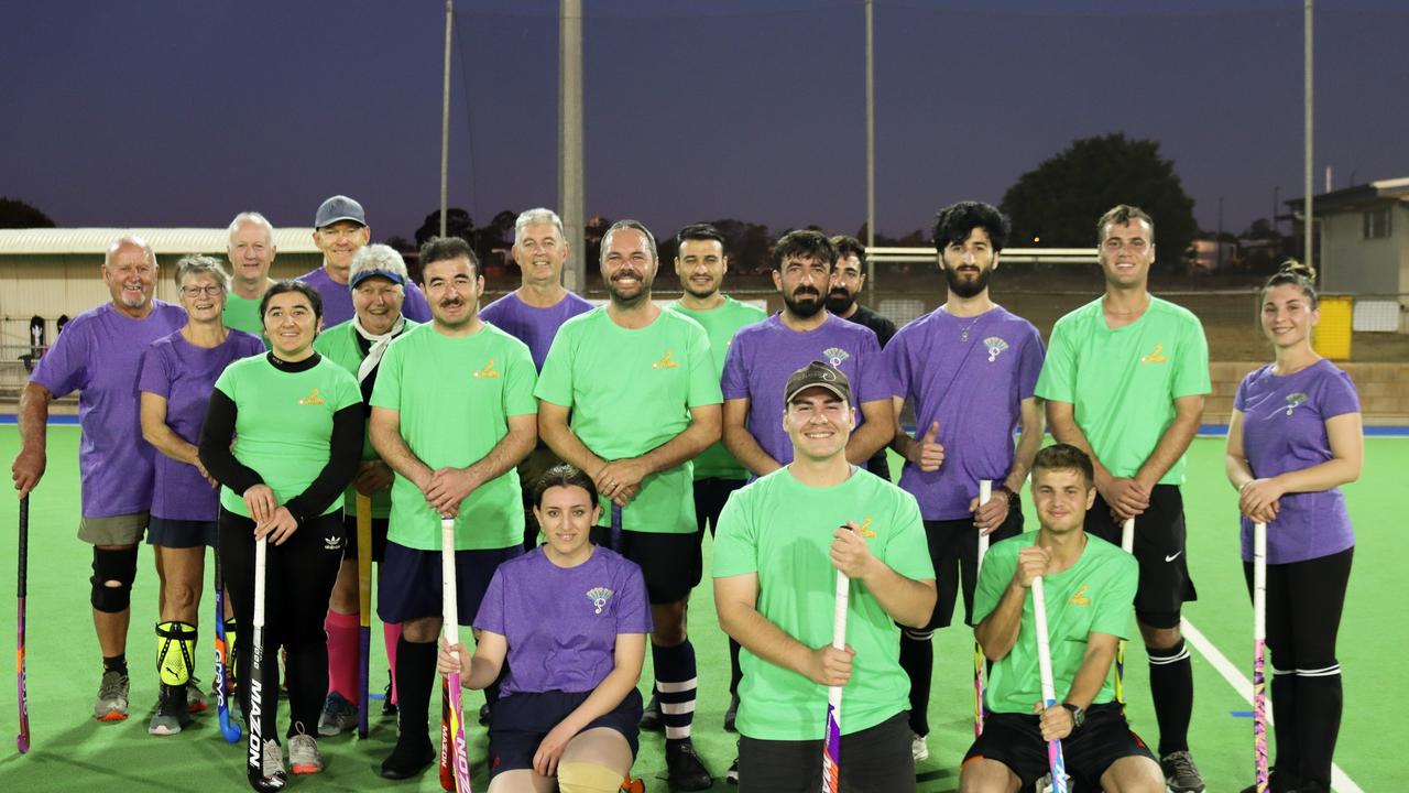 Members of Toowoomba's Yezidi refugee community take part in Toowoomba Hockey Association's Belong in Hockey community.