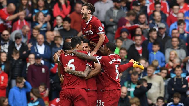 Liverpool players celebrate Coutinho’s goal against Middlesbrough on Sunday.