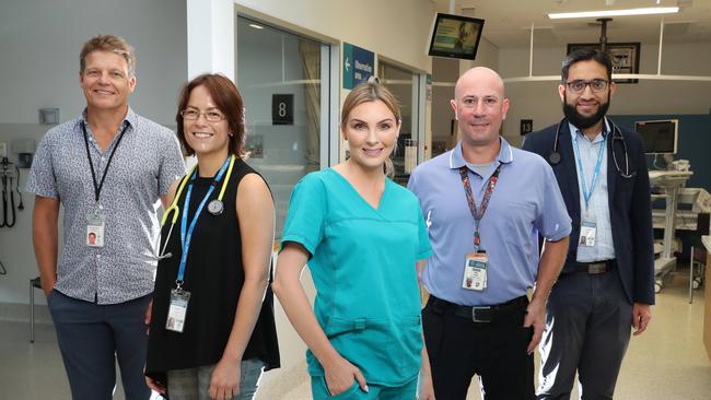 Dr Jon Field, Dr Kylie Alcorn, Clinical Nurse Kirsten Hallam, Registered Nurse Ian Cook, and Dr Salm Memon, ready for their COVID-19 vaccination, Gold Coast University Hospital in February last year. Photographer: Liam Kidston