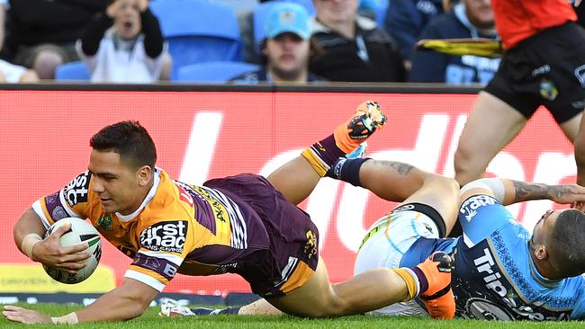 Kodi Nikorima of the Broncos scores a try against the Titans. Photo: AAP