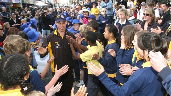 Alastair Clarkson mobbed by fans in Hobart.