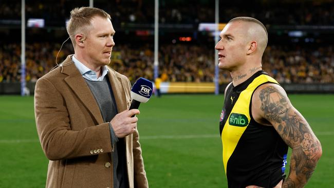 Dustin Martin of the Richmond Tigers is interviewed by former teammate Jack Riewoldt after this 300th match. Picture: Getty Images