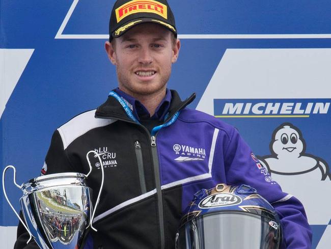 Michael Blair with the trophy after taking out the last race of the season at Phillip Island.