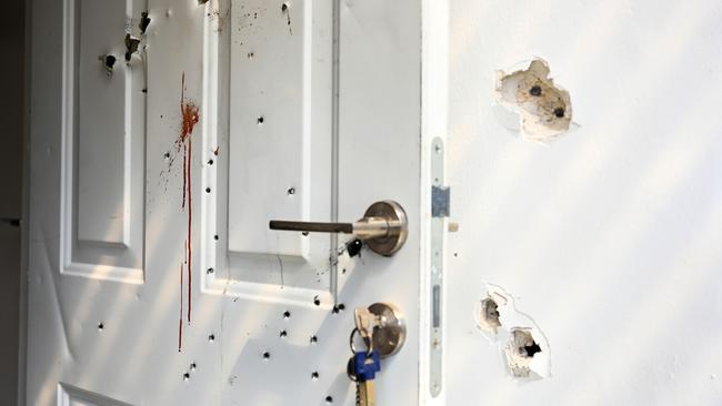 Gunshots and blood stains are seen on a door and walls of a house where civilians were killed on October 7 in Kfar Aza, Israel. Picture: Getty