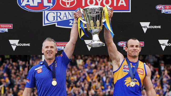 Eagles head coach Adam Simpson and Shannon Hurn of the Eagles hold up the 2018 premiership cup. Picture: Michael Dodge/AFL Media/Getty Images