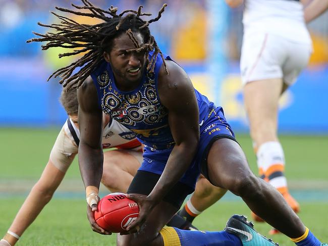 PERTH, AUSTRALIA - JULY 08: Nic Naitanui of the Eagles looks to handball during the round 16 AFL match between the West Coast Eagles and the Greater Western Sydney Giants at Optus Stadium on July 8, 2018 in Perth, Australia.  (Photo by Paul Kane/Getty Images)