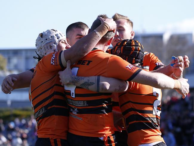 The Oaks celebrate Ben Scambary’s (No. 4) try. Picture Warren Gannon Photography