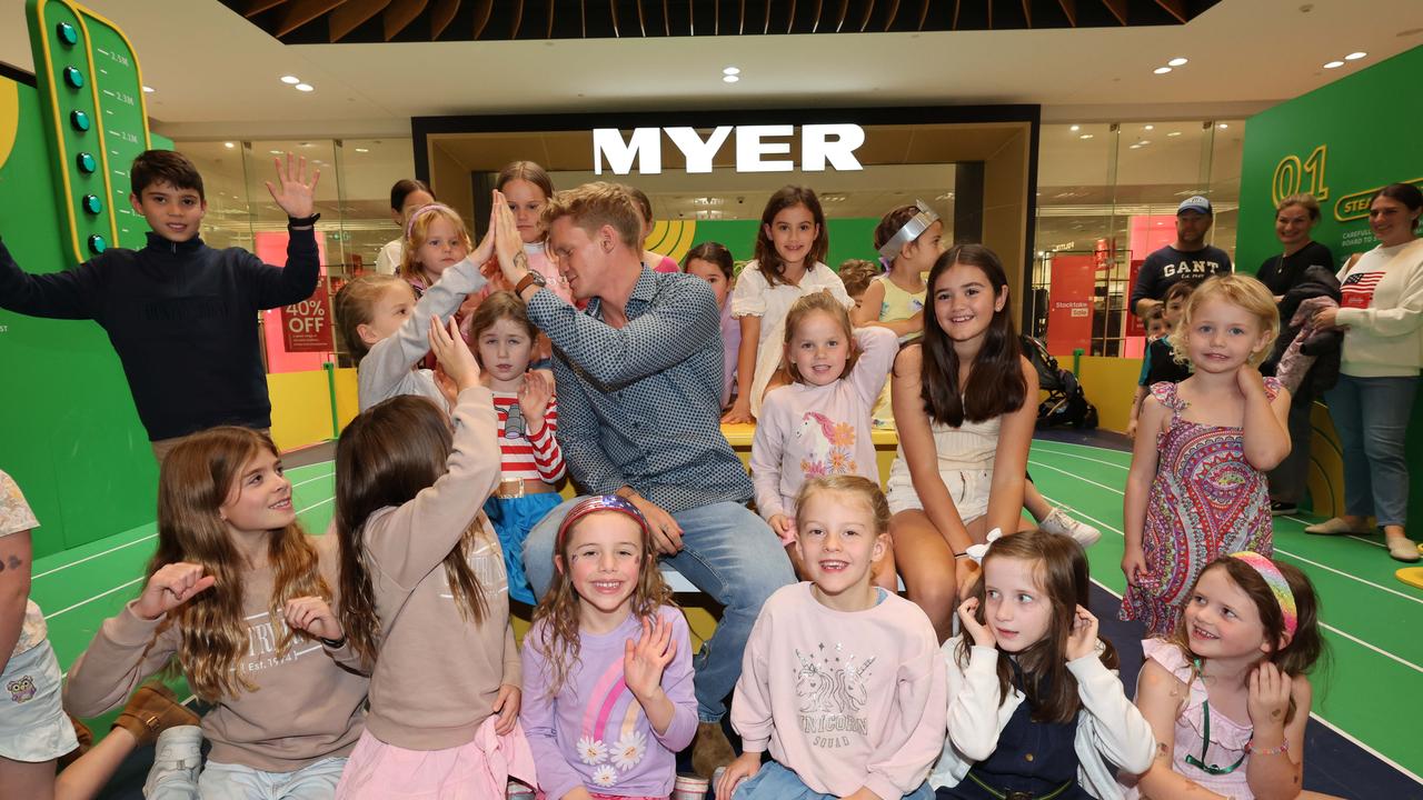 Kids pose for a photo with Cody Simpson at a meet-and-greet at Robina Town Centre outside Myer . Picture Glenn Hampson