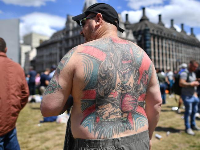 Members of far right groups gather as they stand guard over statues in parliament Square in central London. Picture: AFP