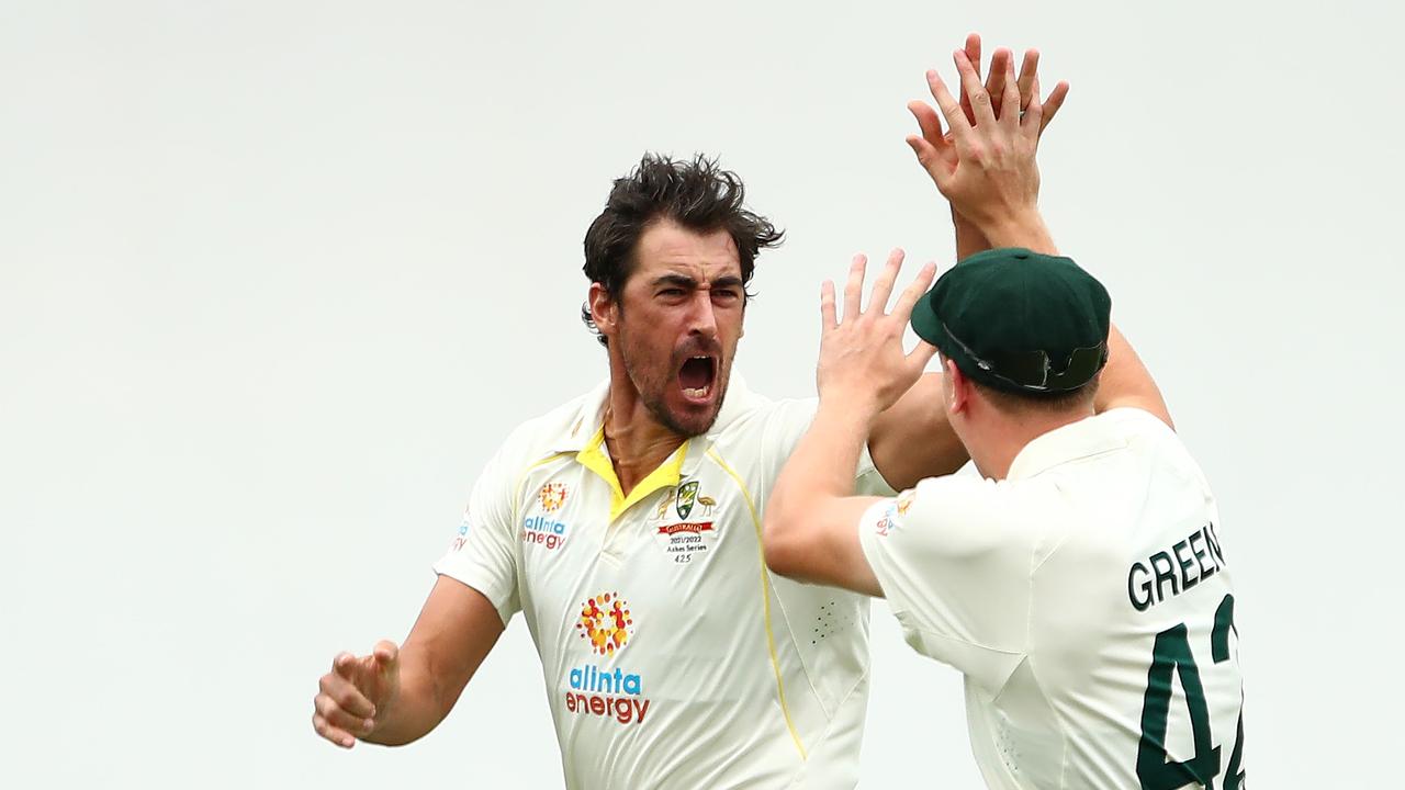 Mitchell Starc celebrates dismissing England’s Rory Burns. Photo Getty Images