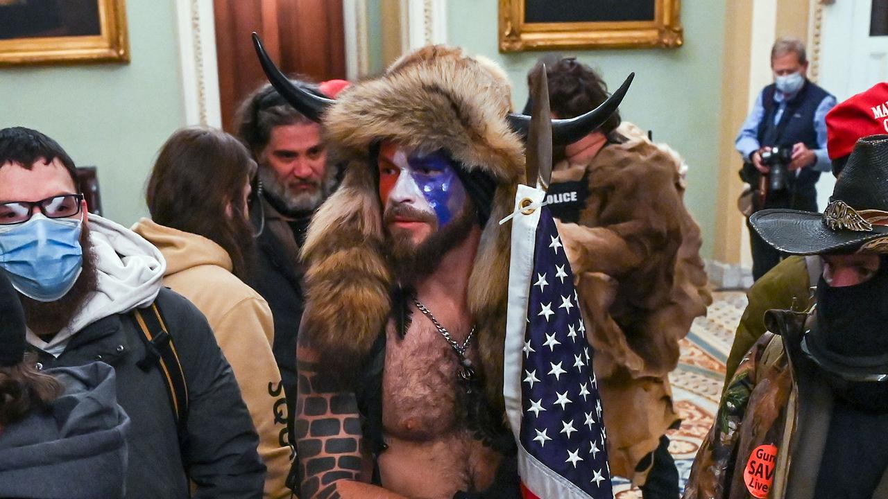 Jake Angeli, a QAnon supporter known as the QAnon Shaman, enters the Capitol in Washington. Picture: Saul Loeb/AFP