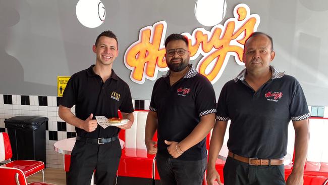 McDonald’s employee Ryan was the first customer and is welcomed by Deepak Dhiman and Roland Mendonca at Greystanes.