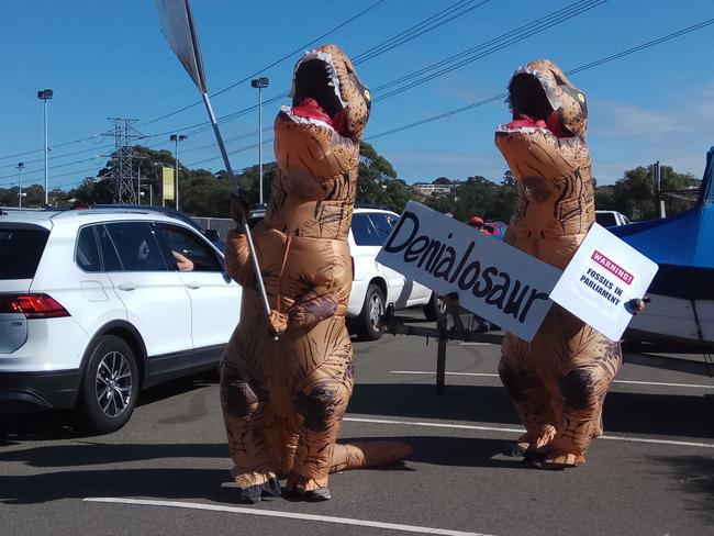 The man in the T-rex suit claimed Mr Kelly made a threat of violence after seeing their signs. Picture: Supplied