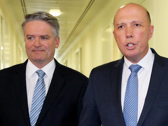 Mathias Cormann and Peter Dutton leave the party room on August 24 after losing last Friday's party vote. Picture: Ray Strange.