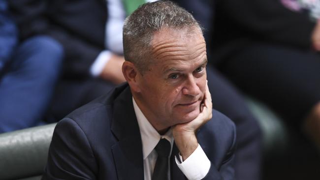 Bill Shorten listens to Scott Morrison speak at the dispatch box. Picture: AAP.