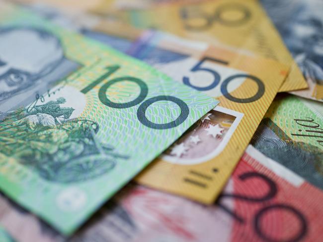 Australian money background showing $100, $50 and $20 notes with a shallow depth of field.