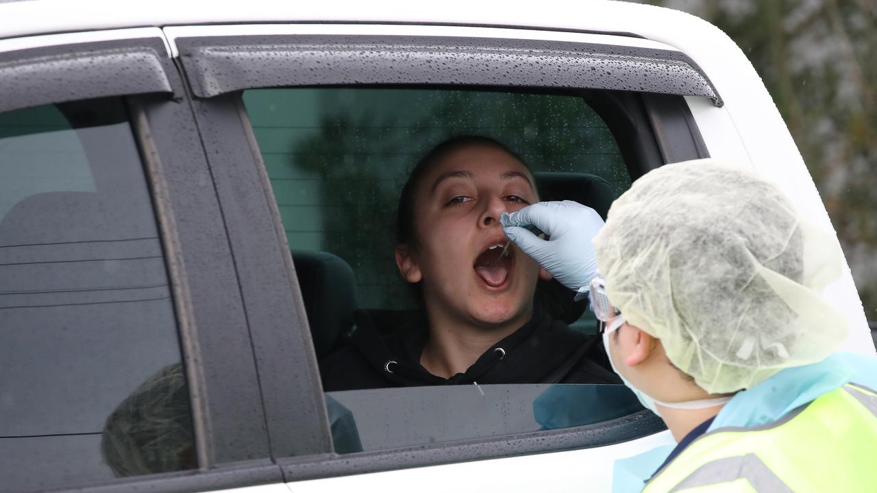 NSW Health have established a COVID-19 pop-up testing clinic at the carpark of Crossroads Hotel at Casula after two people tested positive to the virus. Picture: David Swift