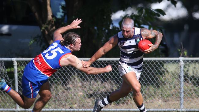 Liam Brandt palms off Jack Taylor. Picture: Brendan Radke