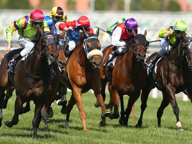 Damian Lane and Durendal (left) swoop on their rivals to win the Western Health Foundation Handicap. Picture: Getty Images