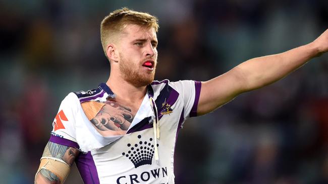 Cameron Munster of the Storm gestures during the Round 14 NRL match between the Sydney Roosters and the Melbourne Storm at Allianz Stadium in Sydney, Saturday, June 11, 2016. (AAP Image/Paul Miller) NO ARCHIVING, EDITORIAL USE ONLY