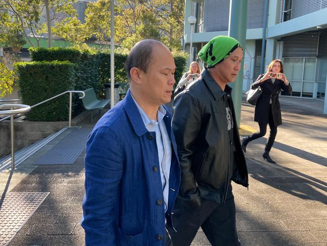 Eric Phu Soksan (blue jacket), 46, of Terrigal, arriving at Gosford Local Court where he was sentenced for sexual touching a young boy. Picture: Richard Noone