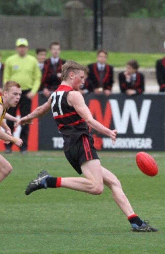 Max Heath taking a kick for Xavier College, where he played in the Herald Sun Shield-winning team.