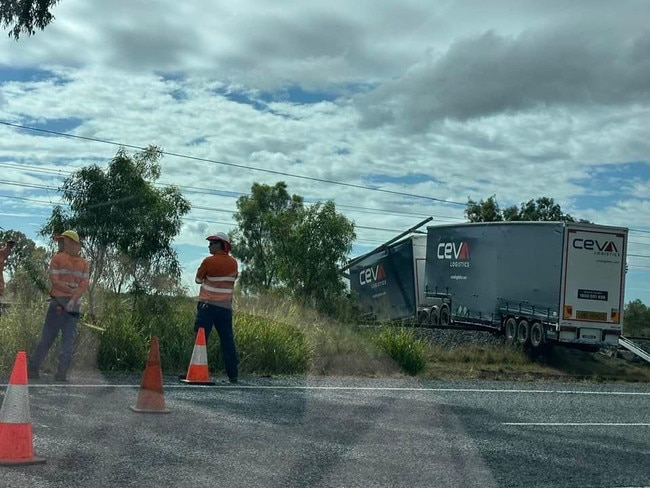 An accident between a truck and vehicle which closed the Bruce Highway at 2.54am at Raglan, 55km south-east of Rockhampton, in the vicinity of Fitzroy Street also took down power lines and prevented any trains crossing rail tracks while the truck was across the rail line. Photo: Contributed