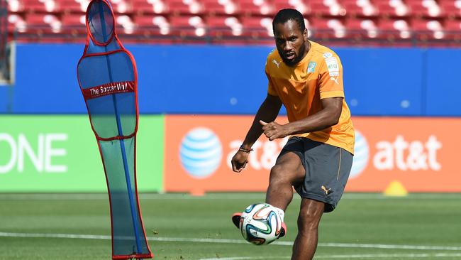 Ivory Coast's forward Didier Drogba practices his free kicks in training.