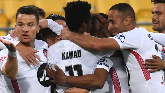 Western Sydney Wanderers players celebrate after Alex Baumjohann (left) scored against Wellington Phoenix on Saturday. Picture: AAP