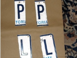 Cut-up license plates were among what police unearthed. Picture: Supplied