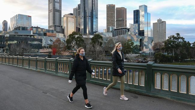 Women walking during stage four lockdown in Melbourne. Picture: Ian Currie