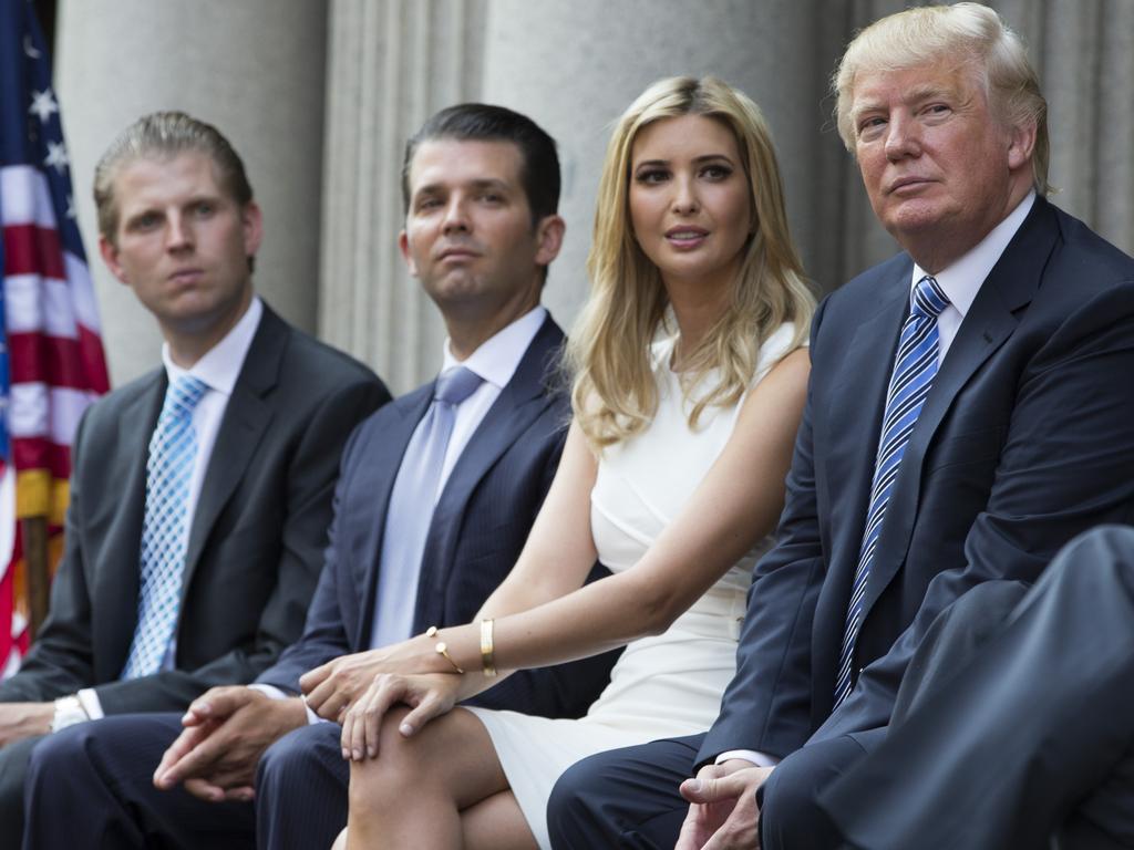 Donald Trump, right, with Eric, Donald Jr., and Ivanka. They are all implicated in a potential lawsuit alleging misuse of funds of the Donald J. Trump Foundation. Picture: AP Photo