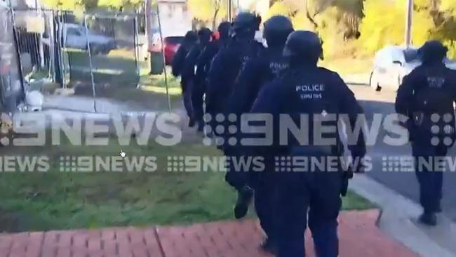 Heavily-armed police carried out raids in Sydney's southwest. Picture: 9 NEWS