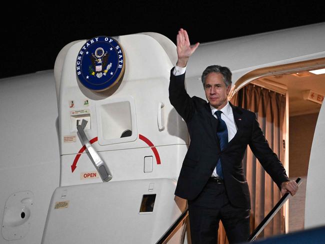 US Secretary of State Antony Blinken waves farewell as he boards his plane in Aqaba on December 14, 2024. (Photo by ANDREW CABALLERO-REYNOLDS / AFP)