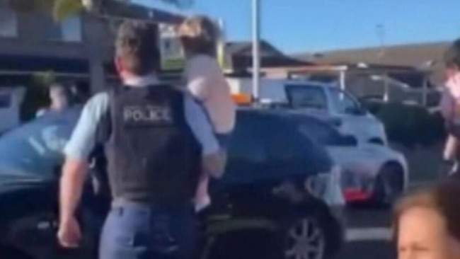 A nearby resident captured the moment the toddler was taken back to the centre by police. Picture: 9 News