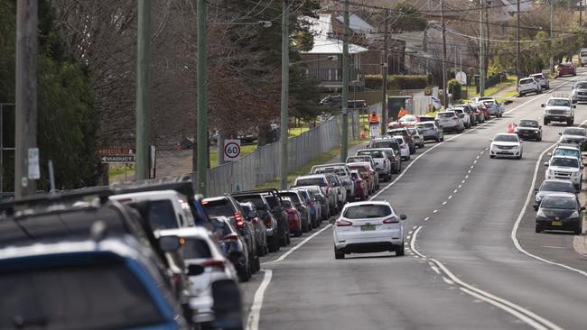 A line of traffic leads to a pop-up COVID-19 testing clinic at Victoria Park in Picton on the outskirts of Sydney’s southwest. The coronavirus cluster in Sydney has also been traced to a Melbourne man Picture: Getty Images