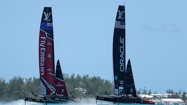 Emirates Team New Zealand helmed by Peter Burling in action racing against Oracle Team USA skippered by Jimmy Spithill.