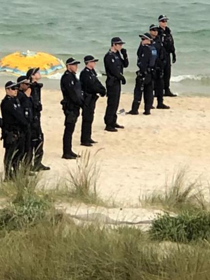 Police at Chelsea beach on Thursday night.