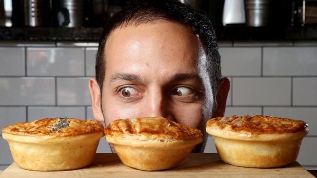 Donny Tiani eyes meat pies at Butter Fingers, in North Adelaide. Picture: Calum Robertson