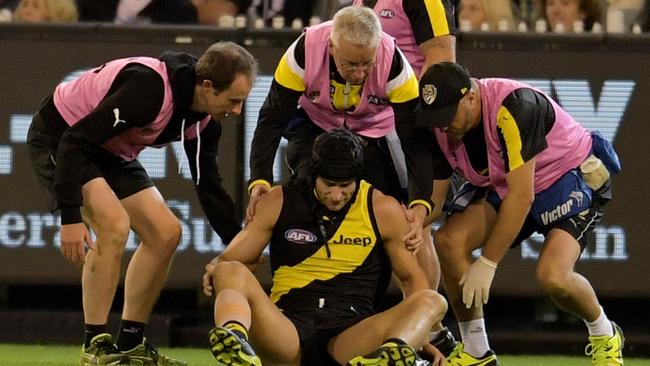 Ben Griffiths is helped by trainers after landing heavily.