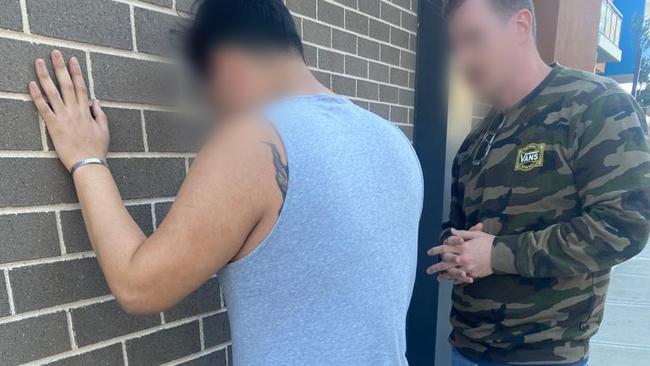 Police arresting a man allegedly involved in the syndicate. Picture: NSW Police