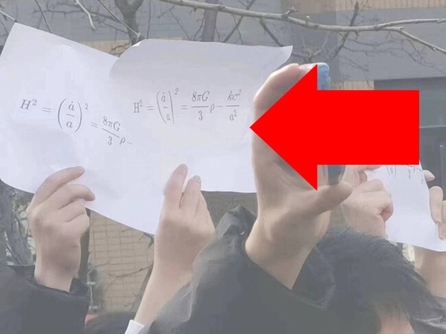 Students from Tsinghua University held up the Friedman equation.