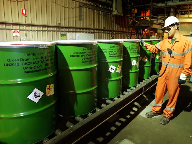 Adrian Boulton checks the packaged barrels of Uranium at BHP Billiton's Olympic Dam project in South Australia.  The mine produces Copper, Gold, Silver & Uranium.