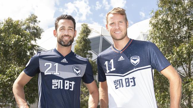 Melbourne Victory Captain Carl Valeri (L) and Ola Toivonen (R) in the club’s ACL playing strips. Picture: AAP