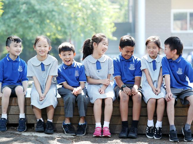 DAILY TELEGRAPH - Pictured at Eastwood Public School today are kids (L-R) Nathan Yuen 7, Isabel Uyu 7, Lucas Zhang 8, Summer Zhou 8, Aszmed Rizmi 8, Angela Nan 8 and Wesley O'Chee 8. Picture: Tim Hunter.