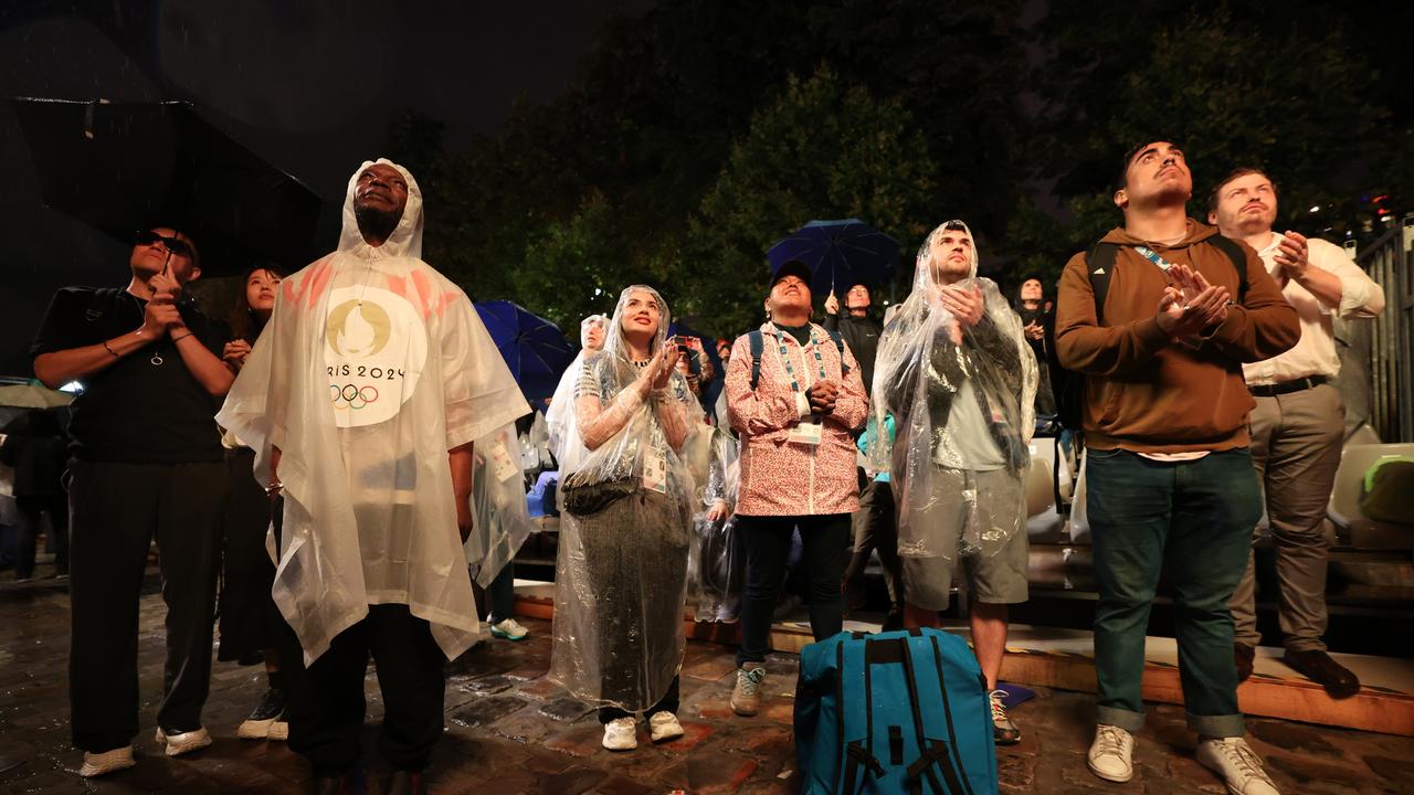 Spectators wearing ponchos to shelter from the rain watch on during the opening ceremony of the Olympic Games Paris 2024. Picture: Steph Chambers/Getty Images