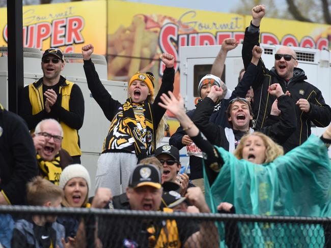 Richmond supporters celebrate at Punt Road Oval. Picture: Tony Gough