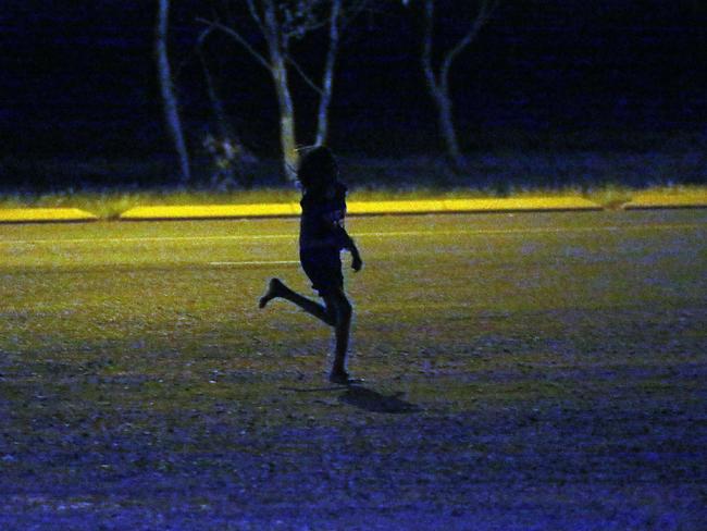 A young girl runs past a petrol station in Tennant Creek. Children as young as seven roam the streets in Tennant Creek NT. From 10pm through to the early hours of the morning children were spotted wondering the streets. Some as young as 11 years old.Picture Gary Ramage