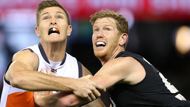 Matthew Lobbe (right) contests a ruck contest against the Giants while playing for Carlton in 2018. Picture: HAMISH BLAIR (AAP).